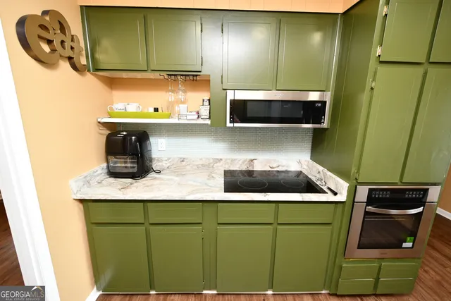 a kitchen with a sink and a microwave