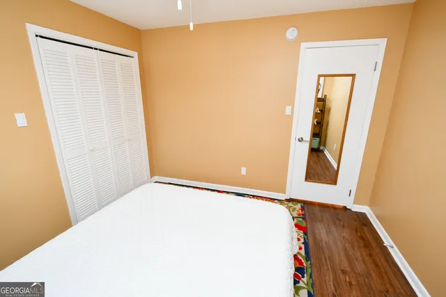 a view of a small space with wooden floor