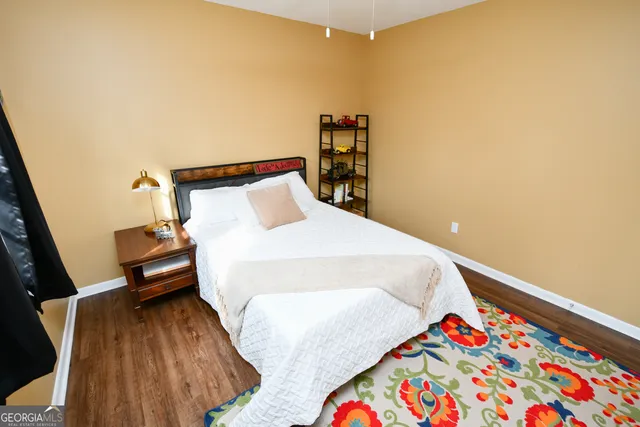 a bedroom with a bed and a book shelf