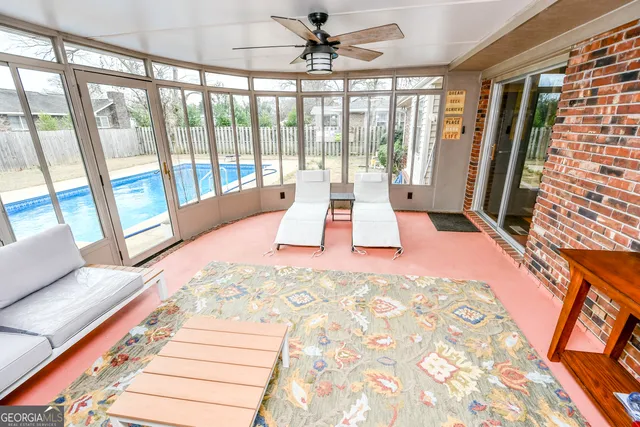 a view of a living room with a large window