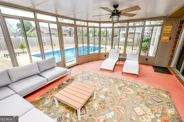 a living room with furniture and a rug