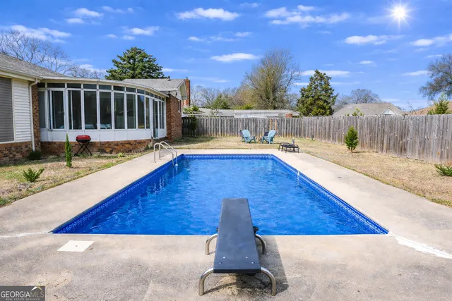 a view of a backyard with sitting area