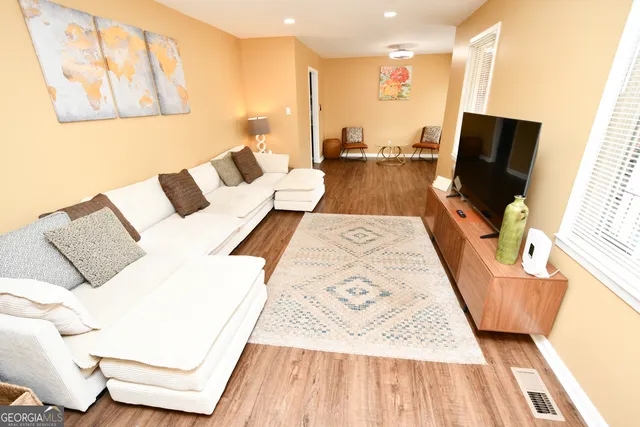 a living room with a couch and a flat screen tv