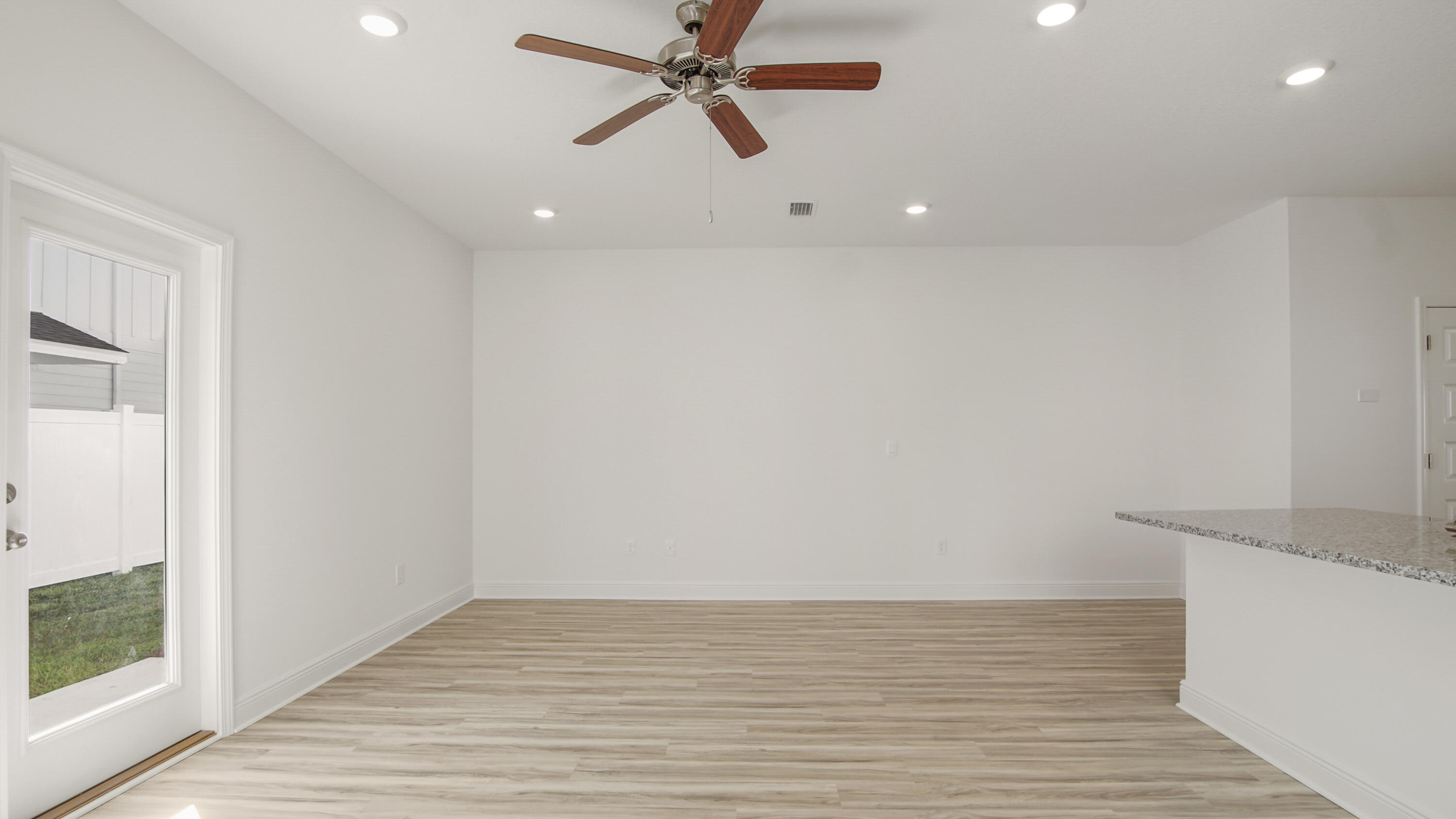 44 Phoenix Street Santa Rosa Beach, FL 32459 - Photo 12 of 37 wooden floor in an empty room with a window