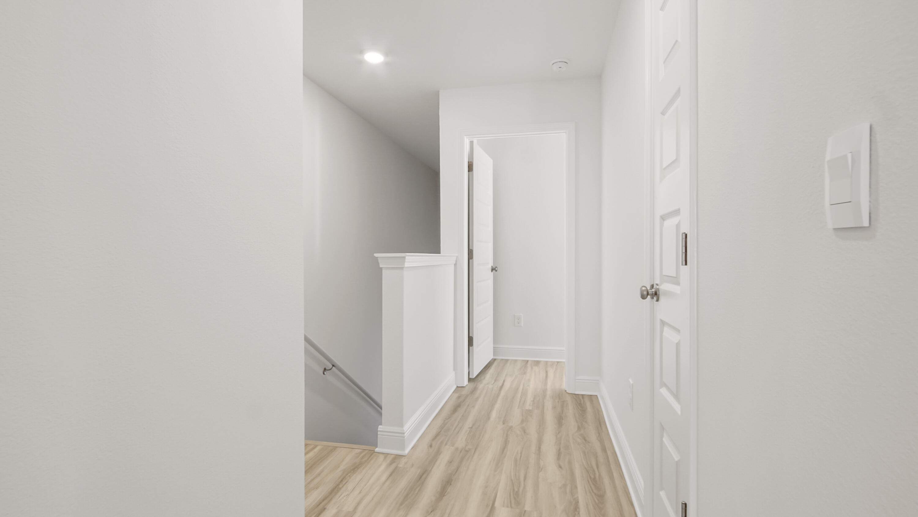 44 Phoenix Street Santa Rosa Beach, FL 32459 - Photo 18 of 37 a view of a hallway with wooden floor and entryway