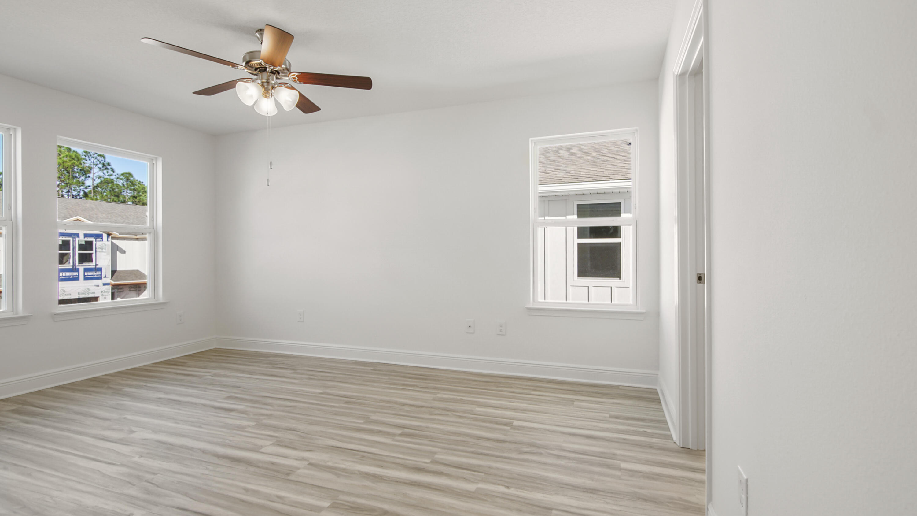 44 Phoenix Street Santa Rosa Beach, FL 32459 - Photo 19 of 37 a view of an empty room with a window and wooden floor