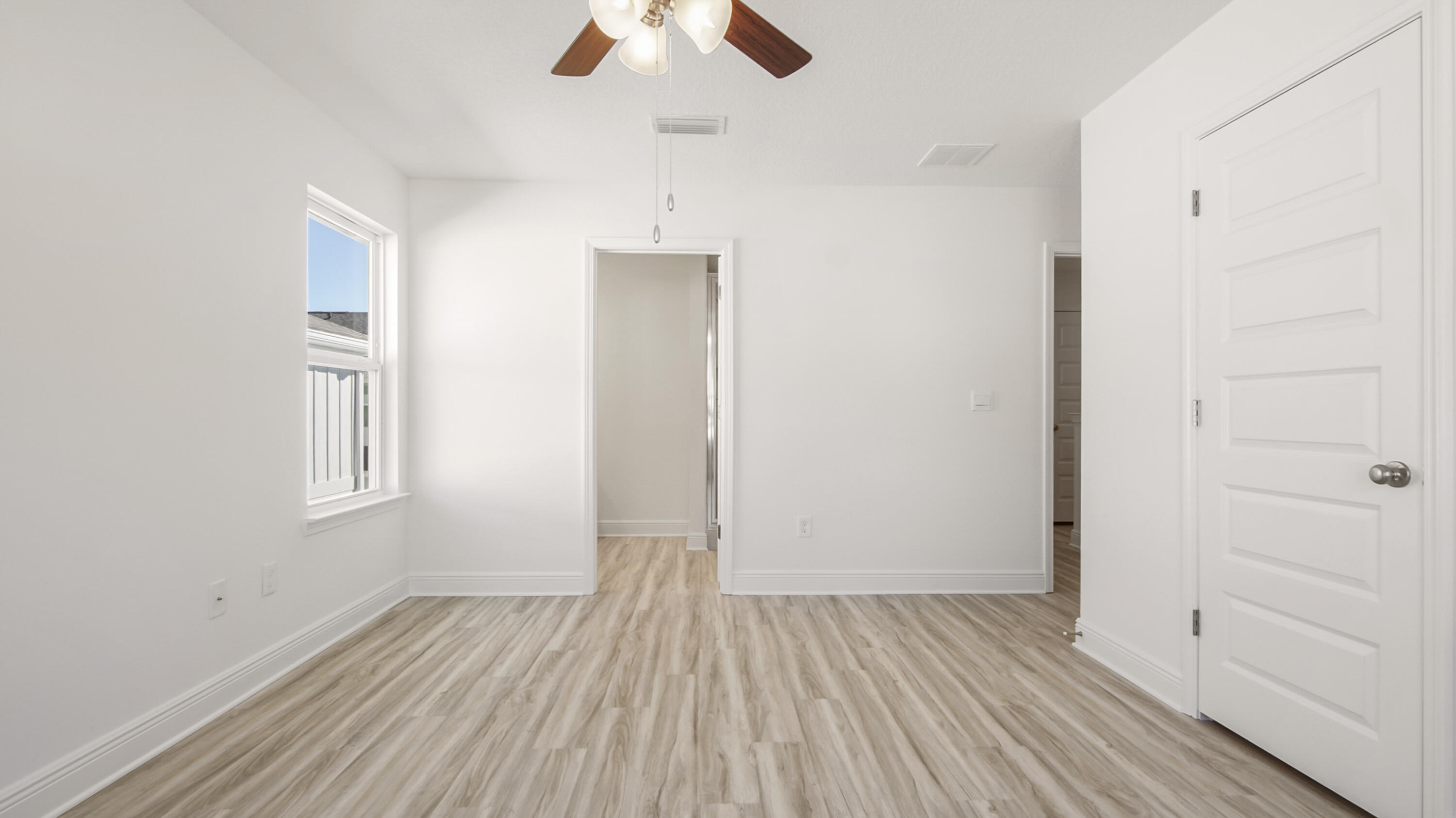 44 Phoenix Street Santa Rosa Beach, FL 32459 - Photo 21 of 37 wooden floor in an empty room with a window