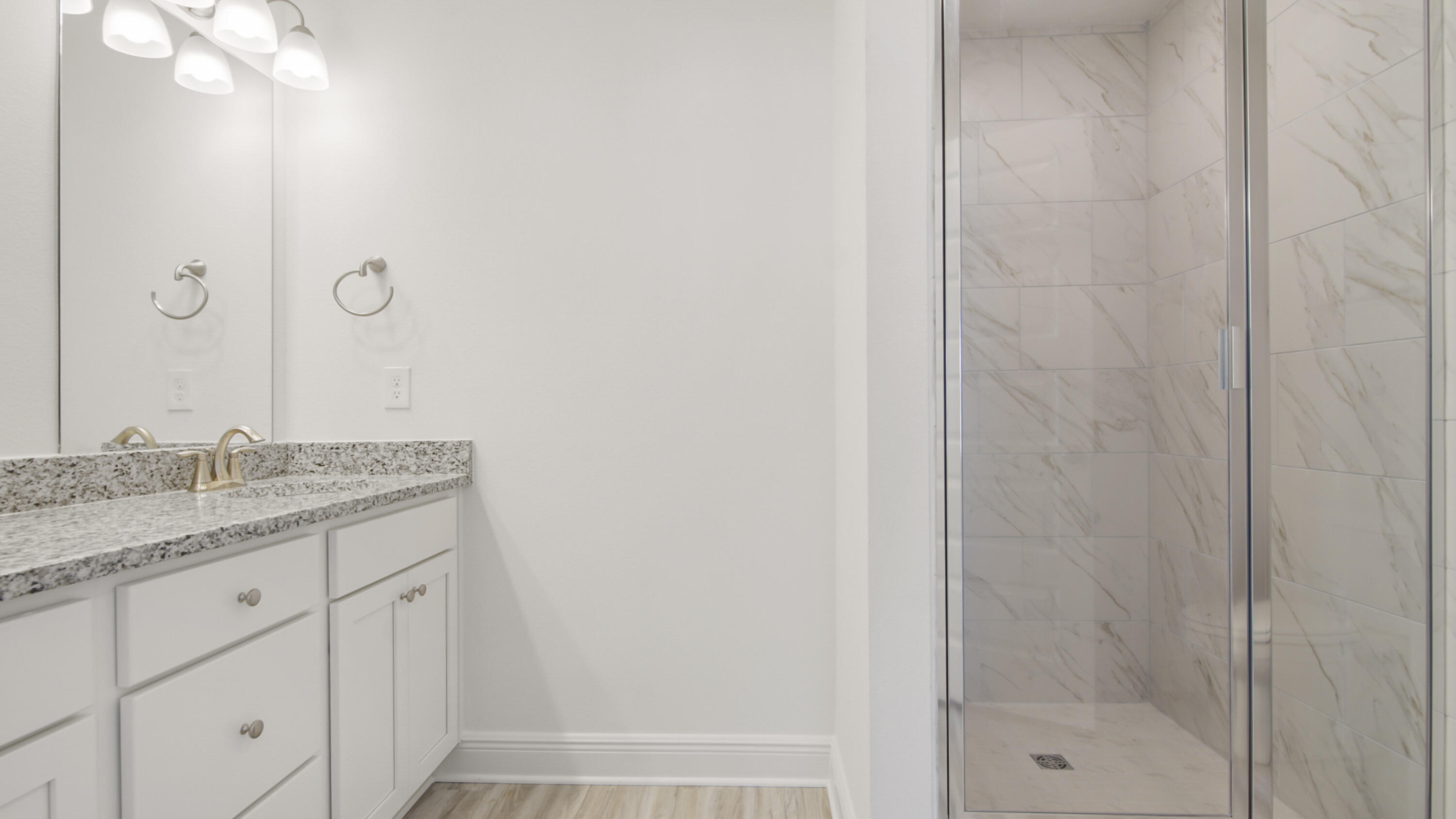 44 Phoenix Street Santa Rosa Beach, FL 32459 - Photo 23 of 37 a bathroom with a granite countertop sink a mirror and shower