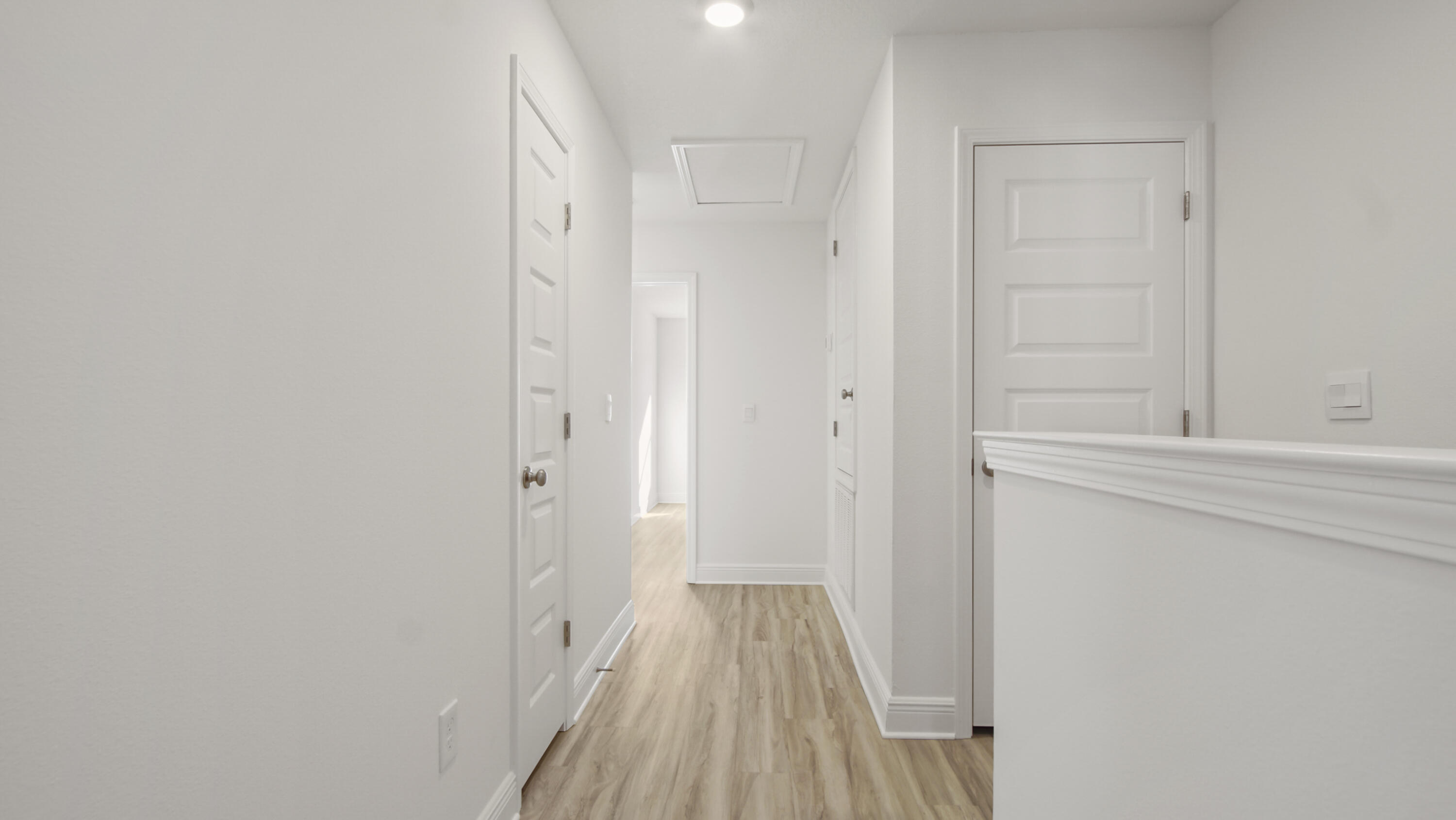 44 Phoenix Street Santa Rosa Beach, FL 32459 - Photo 26 of 37 a view of a hallway with wooden floor and a bathroom