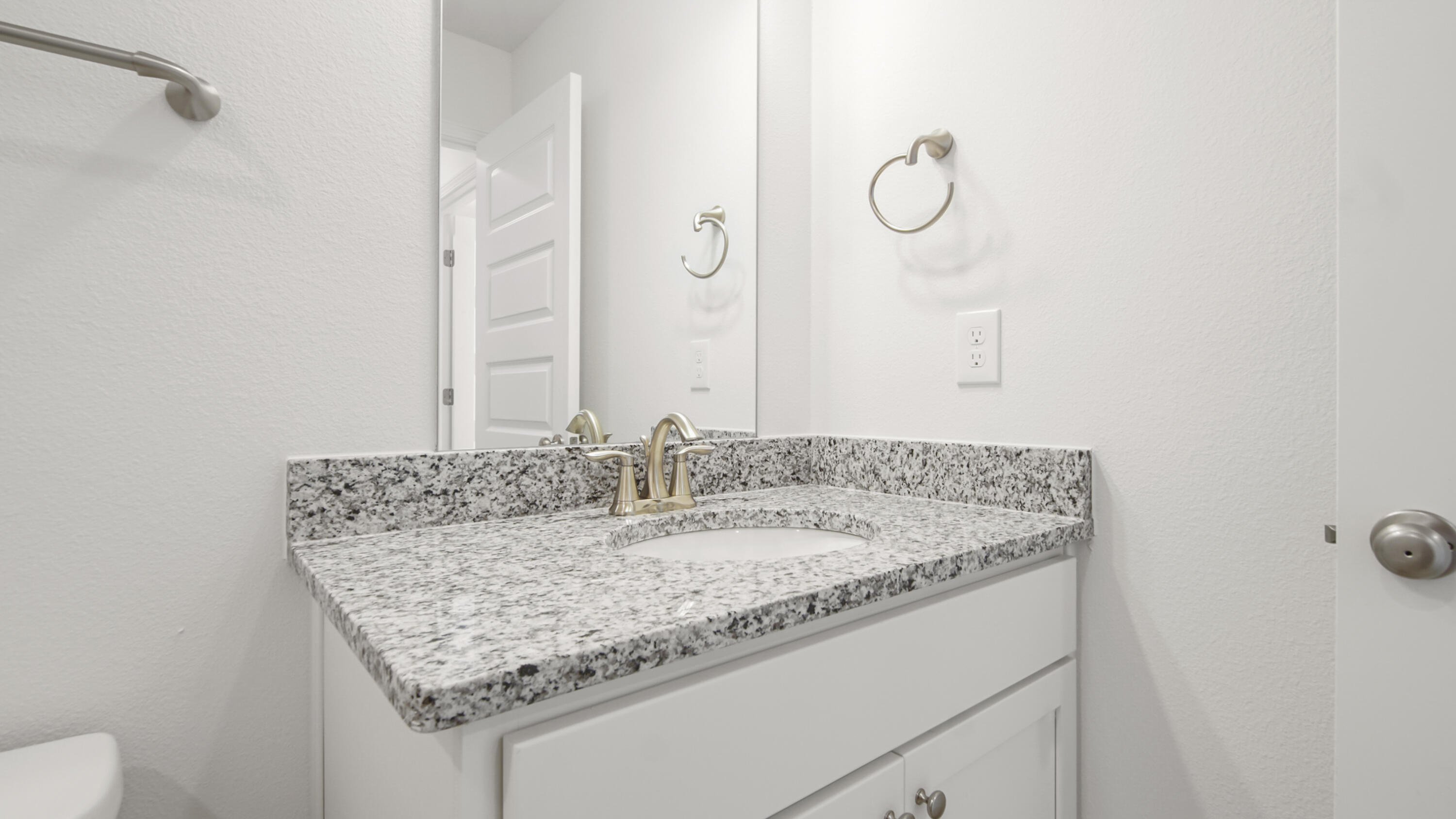 44 Phoenix Street Santa Rosa Beach, FL 32459 - Photo 36 of 37 a bathroom with a granite countertop sink and a mirror