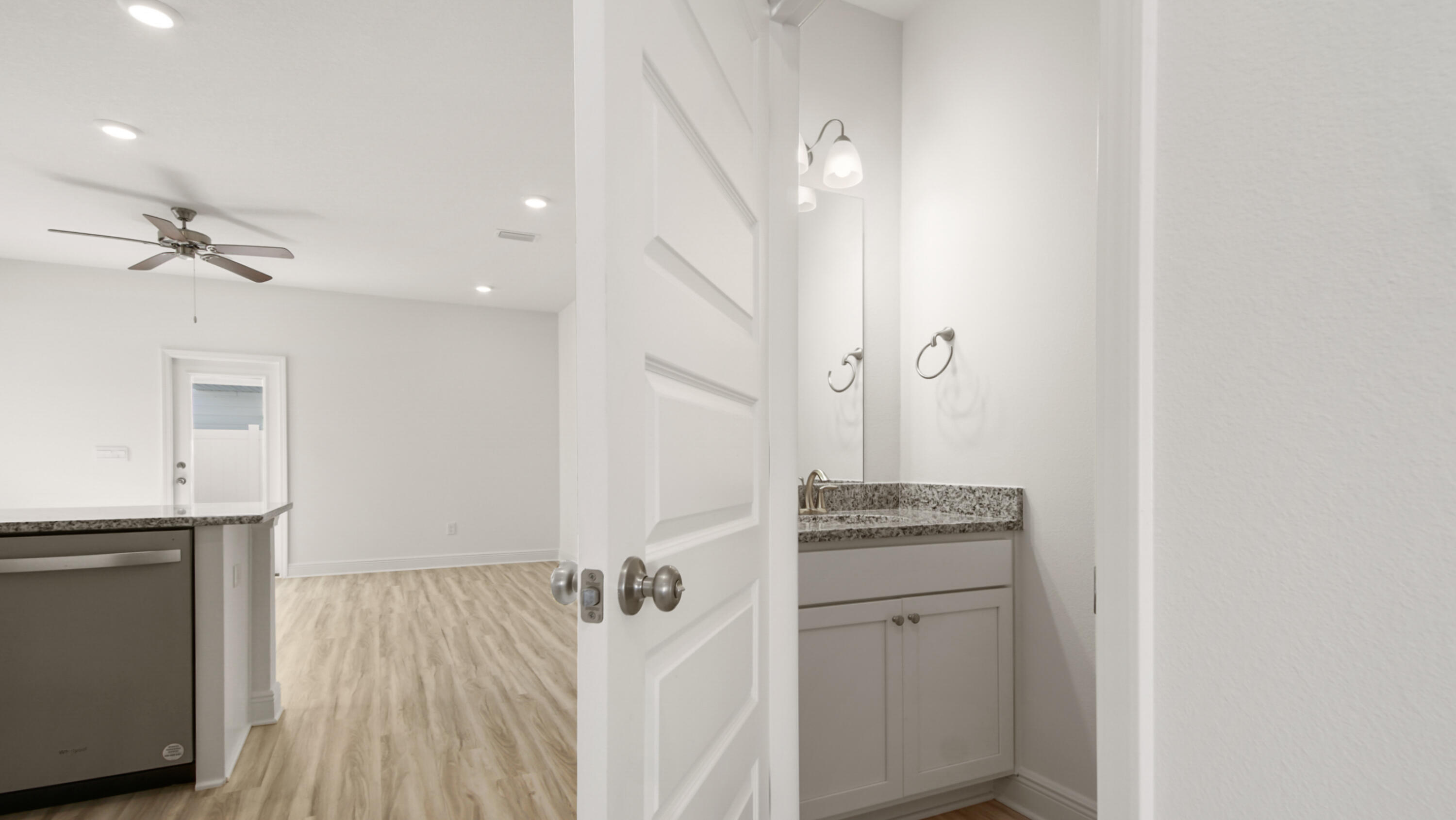 44 Phoenix Street Santa Rosa Beach, FL 32459 - Photo 6 of 37 a room with a stove and a wooden floor