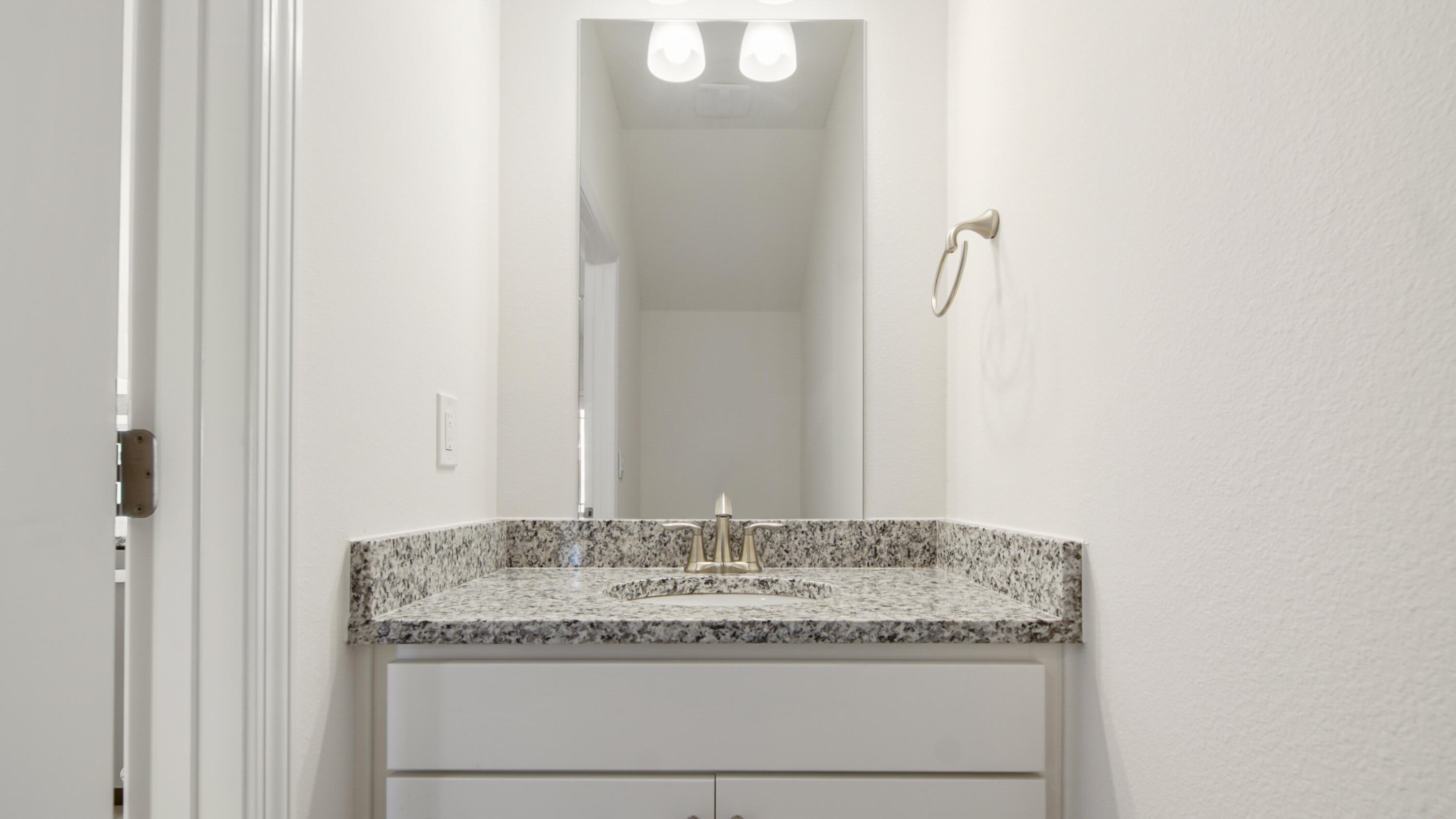 44 Phoenix Street Santa Rosa Beach, FL 32459 - Photo 7 of 37 a bathroom with a granite countertop sink and a mirror