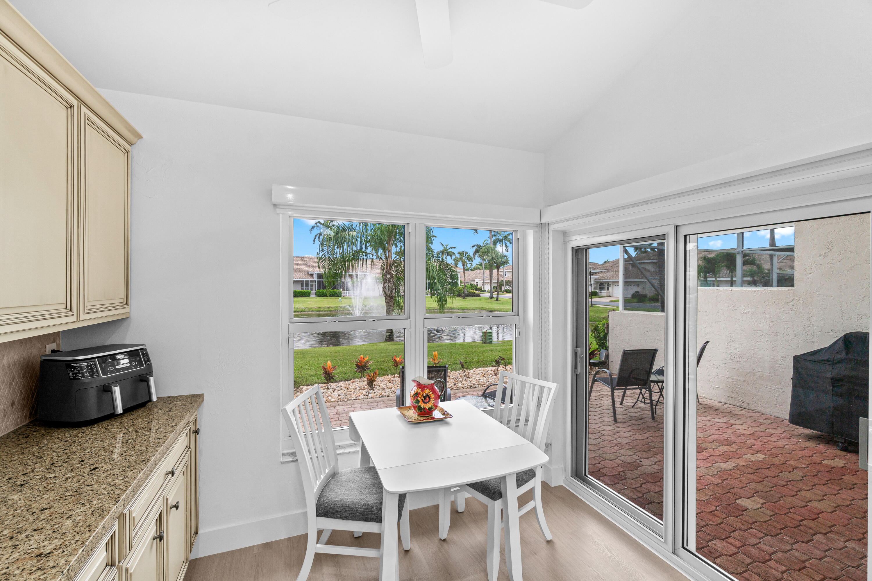 5097 Windsor Parke Drive Boca Raton, FL 33496 - Photo 15 of 27 a view of a dining room with furniture window and outside view