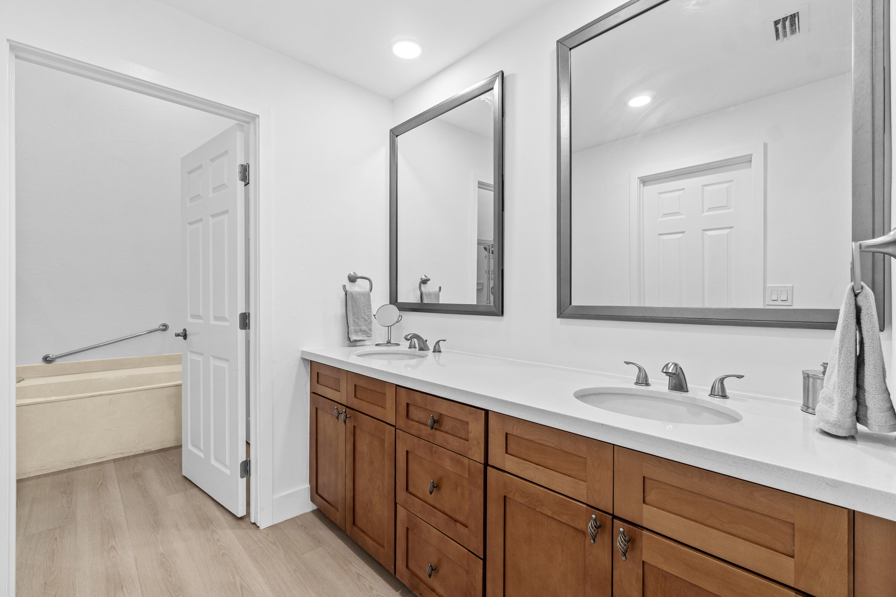 5097 Windsor Parke Drive Boca Raton, FL 33496 - Photo 19 of 27 a bathroom with a double vanity sink mirror double and bathtub