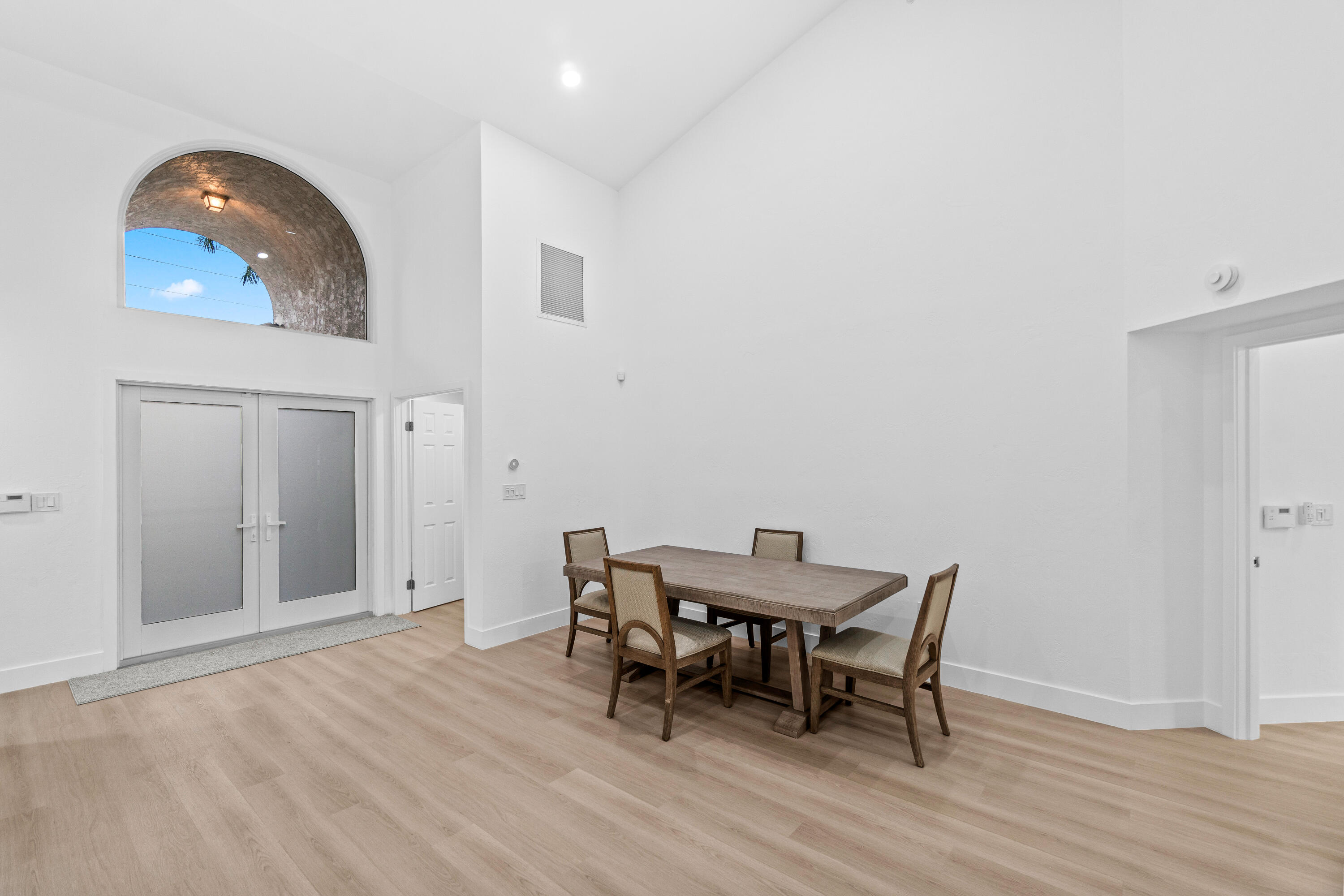 5097 Windsor Parke Drive Boca Raton, FL 33496 - Photo 7 of 27 a view of a dining room with furniture and wooden floor
