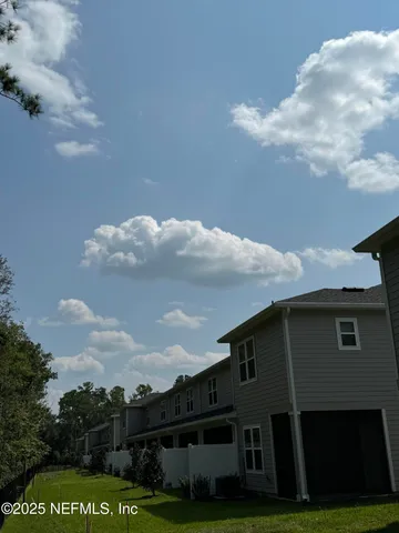 a view of building with yard