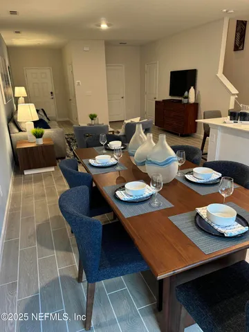 a living room with furniture and a rug