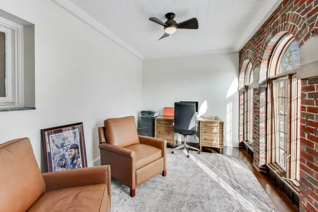 a living room with furniture and entry gate
