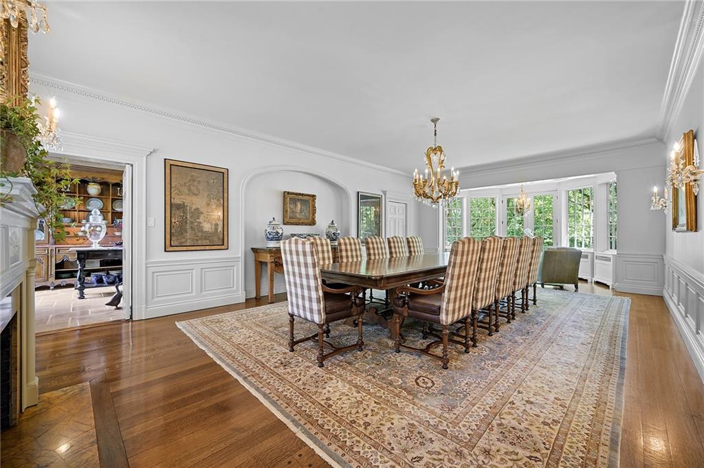 833 Blackburn Road Sewickley, PA 15143 - Photo 8 of 19 a dining room with wooden floor and a rug