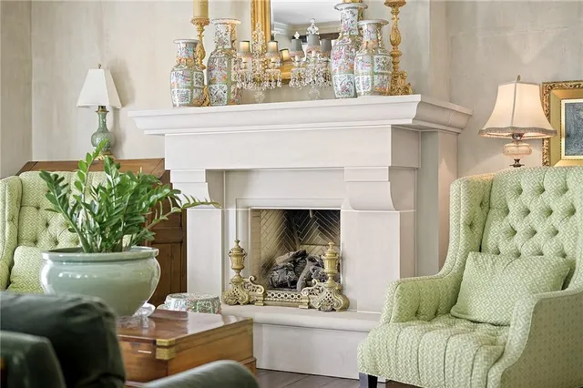 a living room with furniture and a fireplace