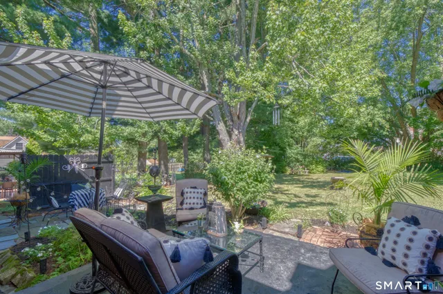 a view of a patio filled with furniture