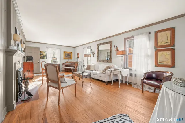 a living room with furniture window and wooden floor