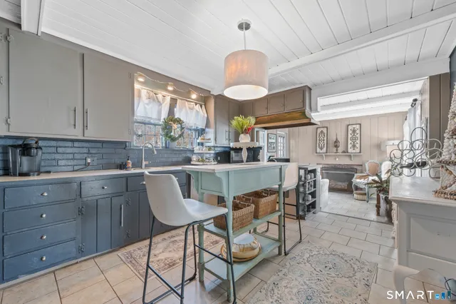 a kitchen with cabinets a sink and appliances