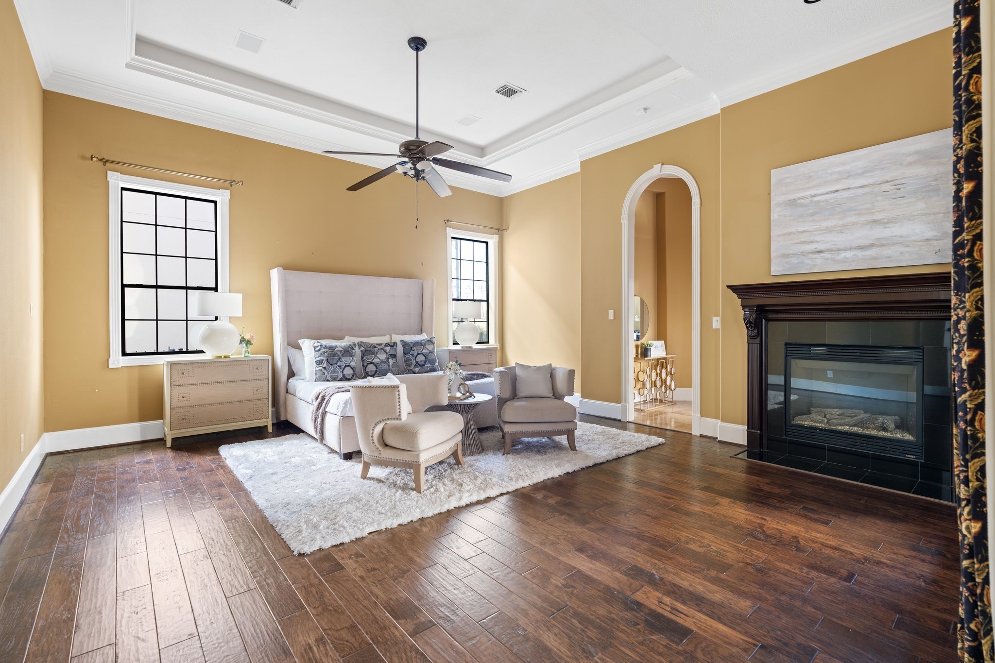 16502 Glorietta Turn Houston, TX 77068 - Photo 25 of 50 First floor primary suite with fireplace and doors leading to the back yard