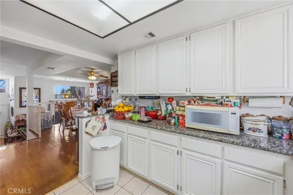 a kitchen with sink a stove and cabinets