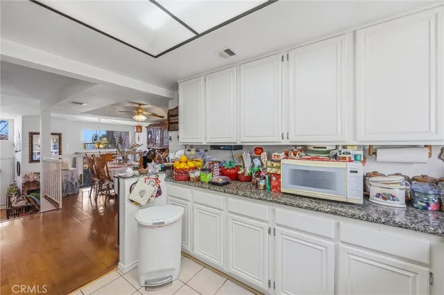 a kitchen with sink a stove and cabinets