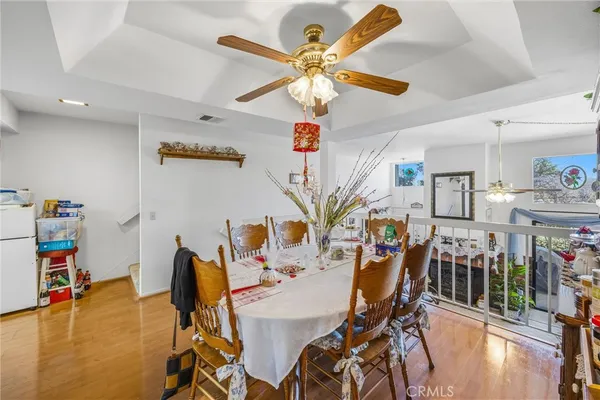 a view of a dining room with furniture and a wooden floor
