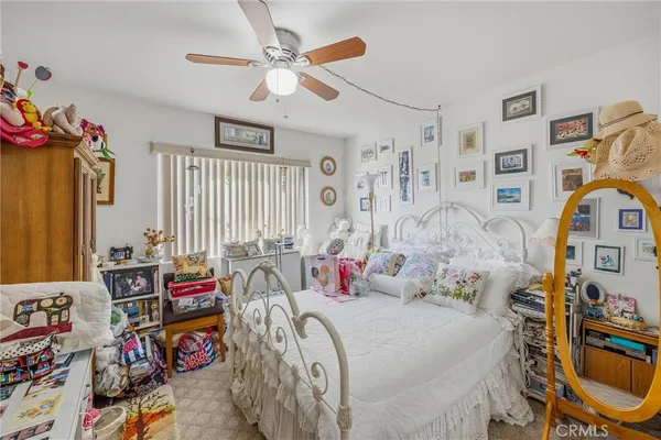 a bedroom with bed and a window