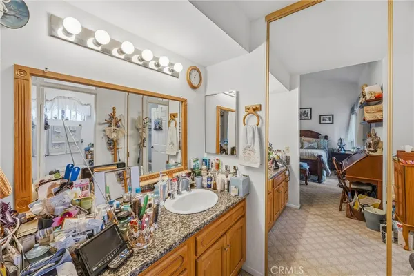 a view of living room kitchen and chandelier