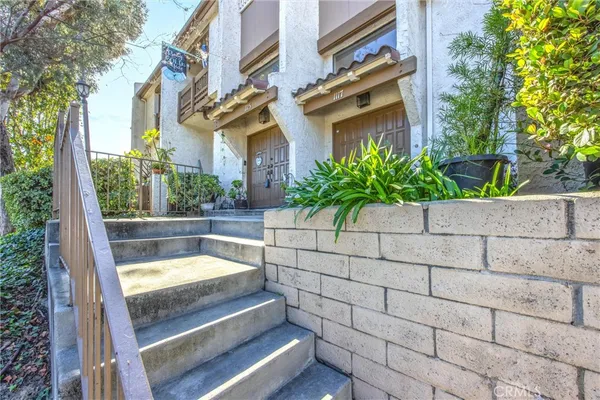 a view of a garden with an outdoor seating