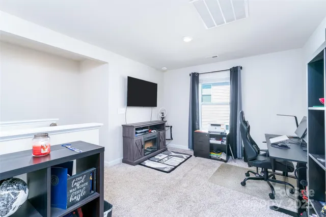 a room with furniture and a flat screen tv