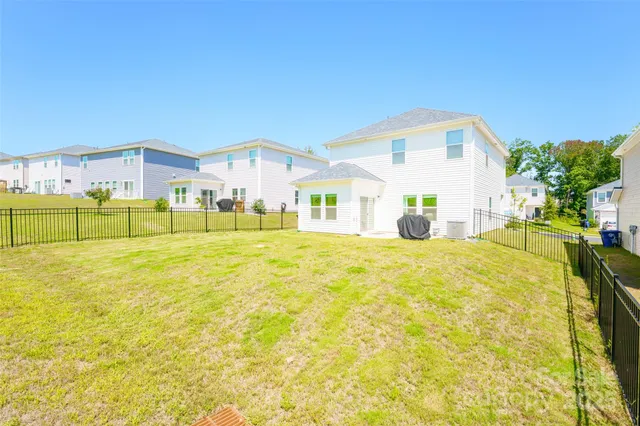 a house view with swimming pool