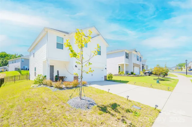 a swimming pool with a yard and sitting space