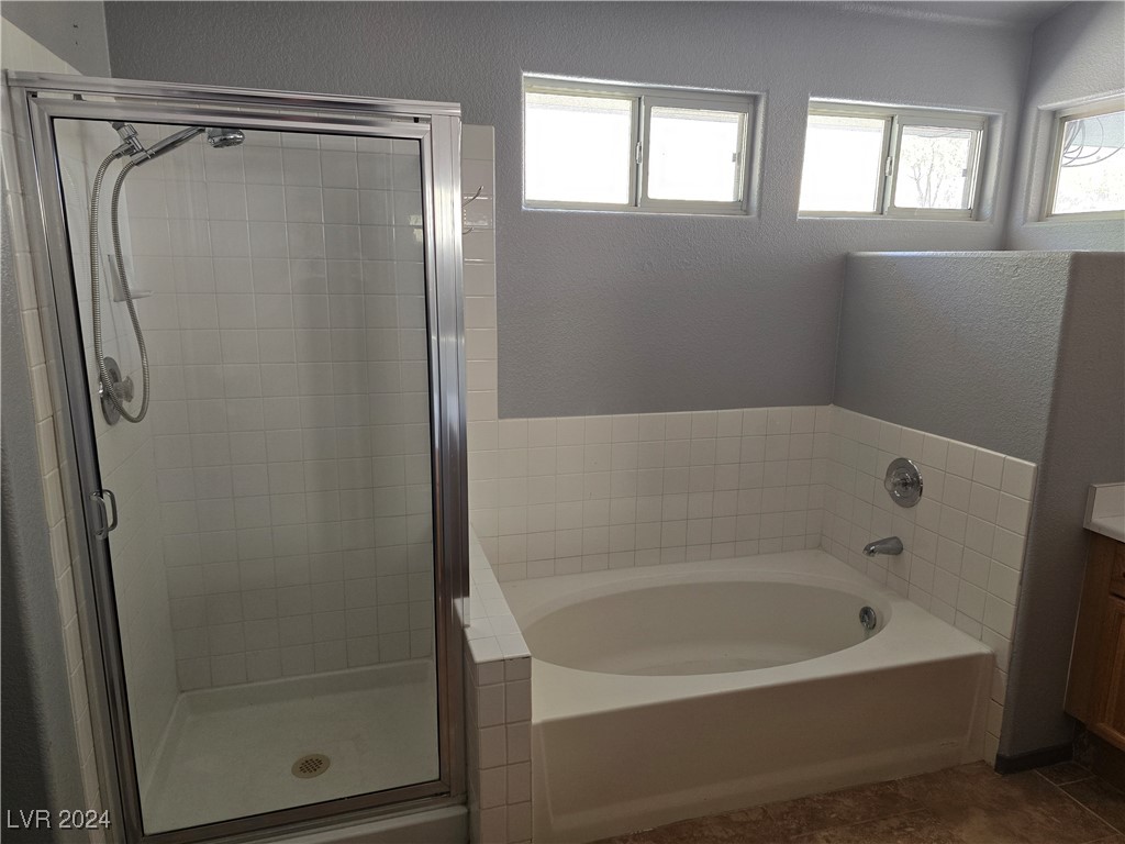 857 Rusty Anchor Way Henderson, NV 89002 - Photo 41 of 91 Separate Soaking Tub and Shower in the Primary Bathroom.