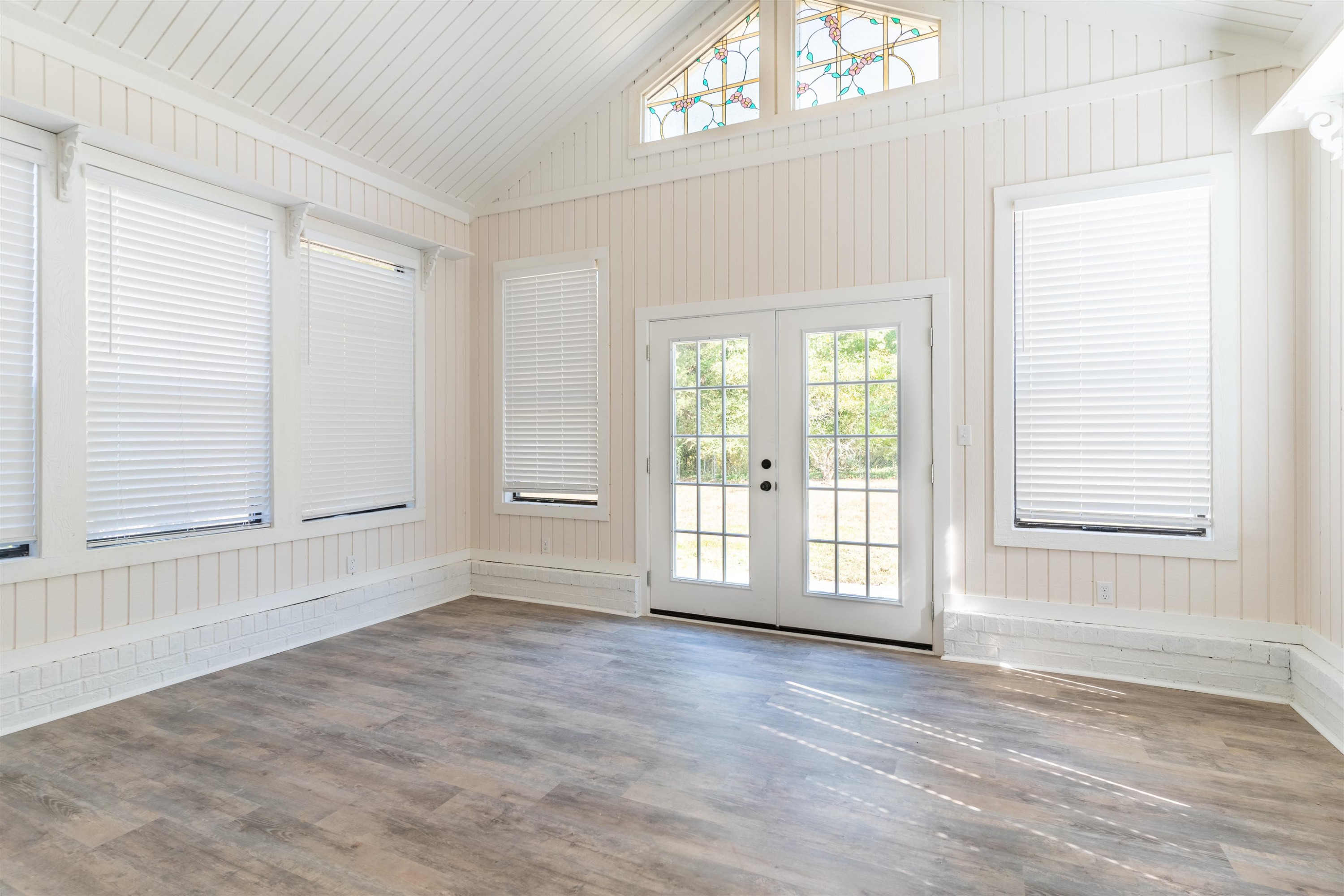 98 Ridgeoak Place Jackson, TN 38305 - Photo 16 of 23 an empty room with wooden floor and windows