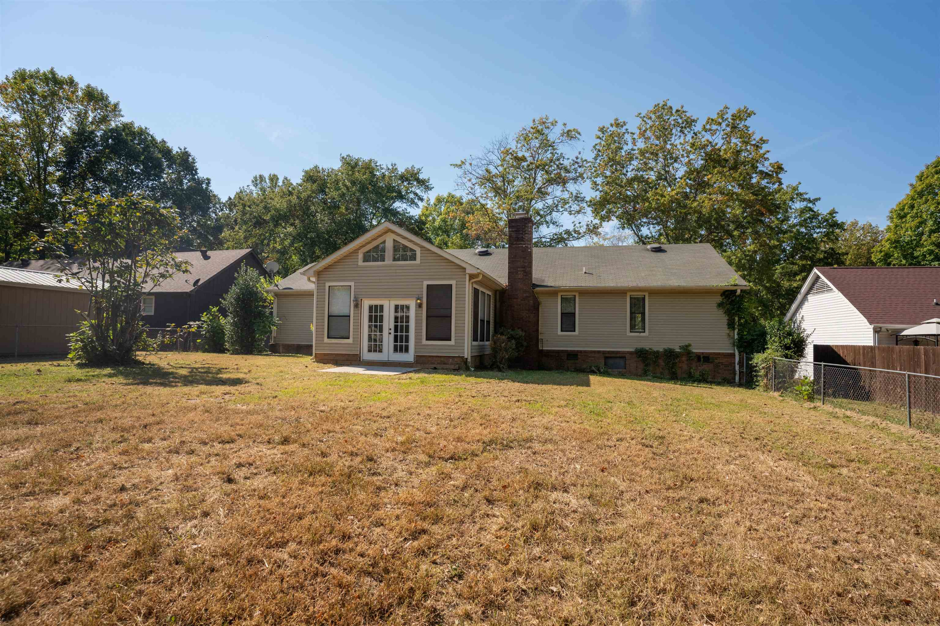 98 Ridgeoak Place Jackson, TN 38305 - Photo 22 of 23 a front view of a house with a yard and trees