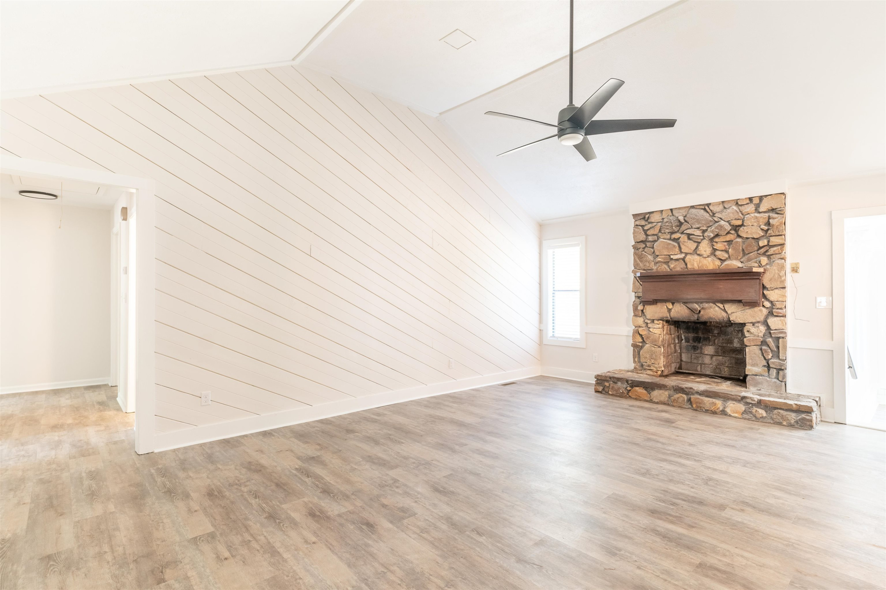 98 Ridgeoak Place Jackson, TN 38305 - Photo 3 of 23 a view of an empty room with a fireplace and a window