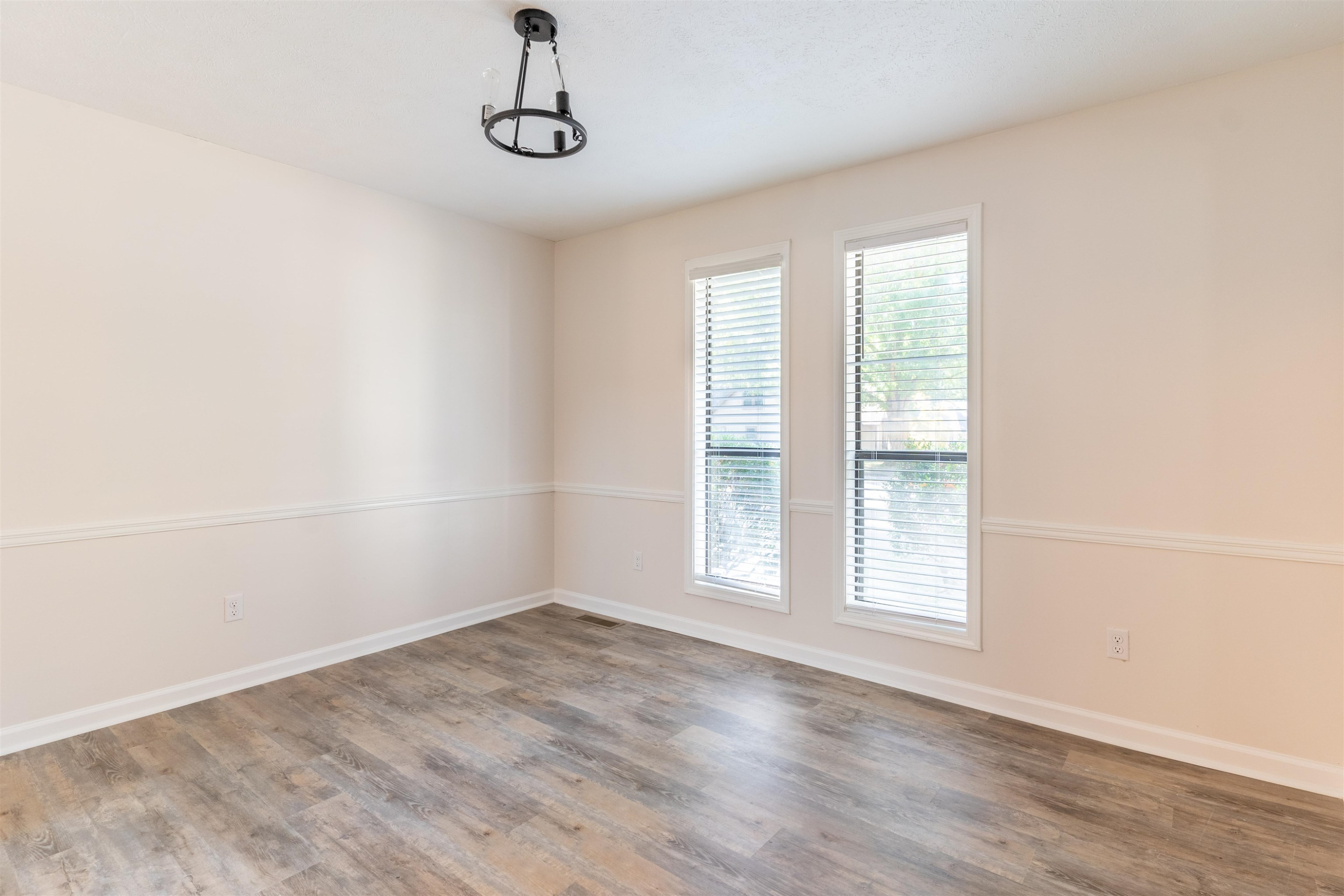 98 Ridgeoak Place Jackson, TN 38305 - Photo 10 of 23 an empty room with wooden floor and windows