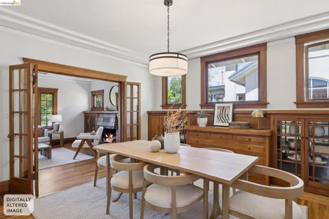 a dining room with furniture a chandelier and wooden floor