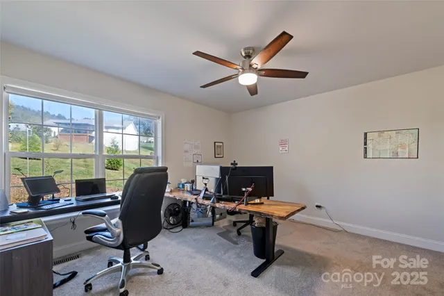 a view of a porch with furniture and a yard
