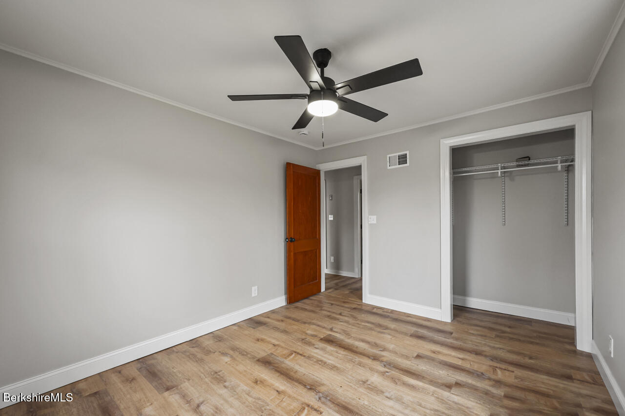 227 Protection Avenue North Adams, MA 01247 - Photo 18 of 25 a view of empty room with wooden floor