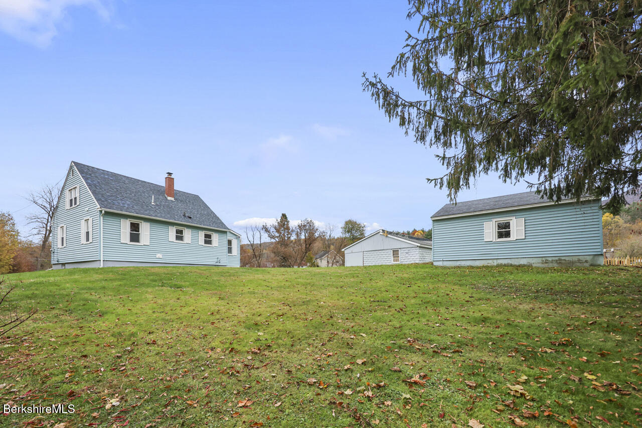 227 Protection Avenue North Adams, MA 01247 - Photo 3 of 25 a house that is sitting in the grass with large trees