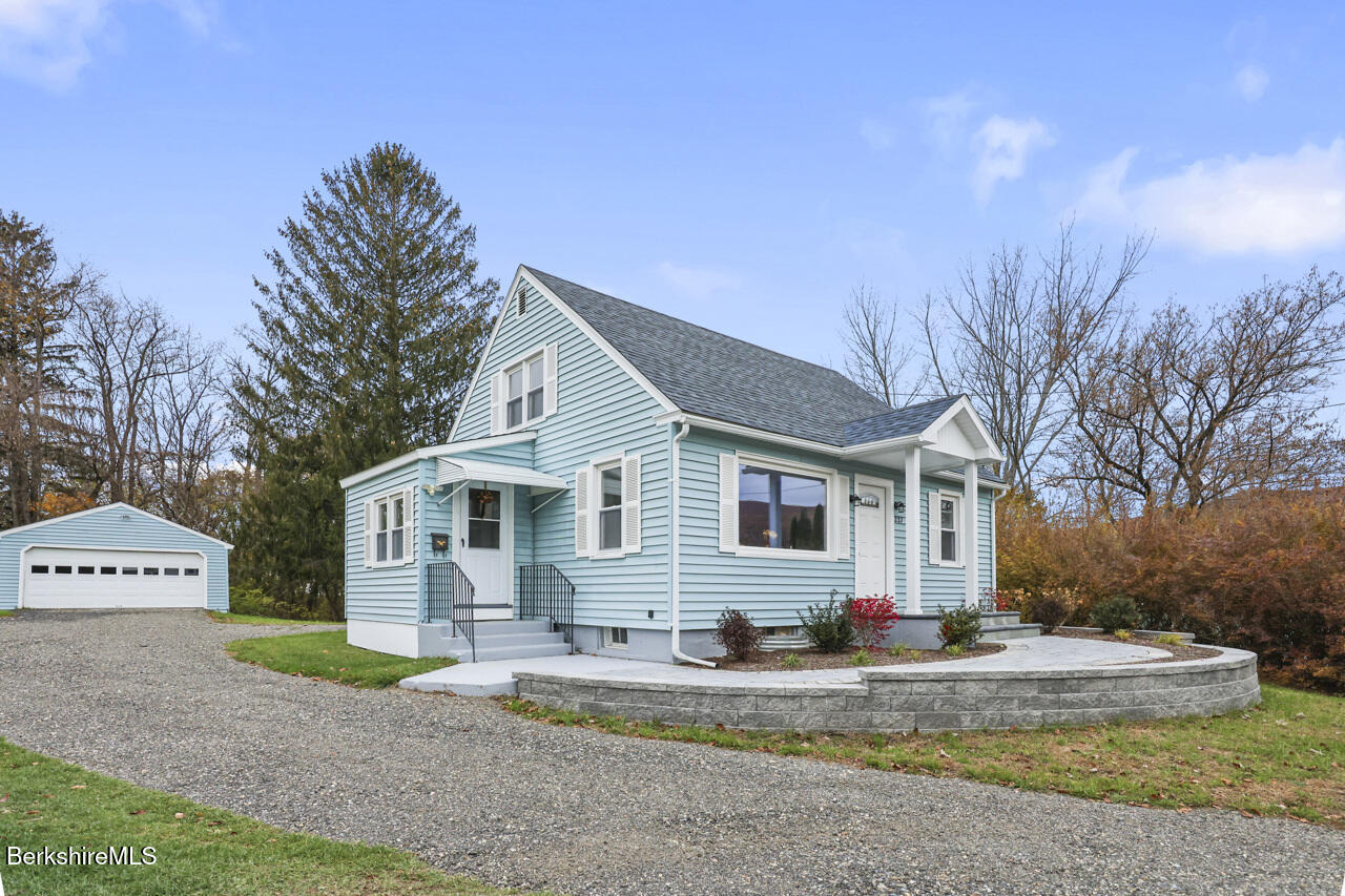 227 Protection Avenue North Adams, MA 01247 - Photo 9 of 25 a view of a white house with a small yard and large trees