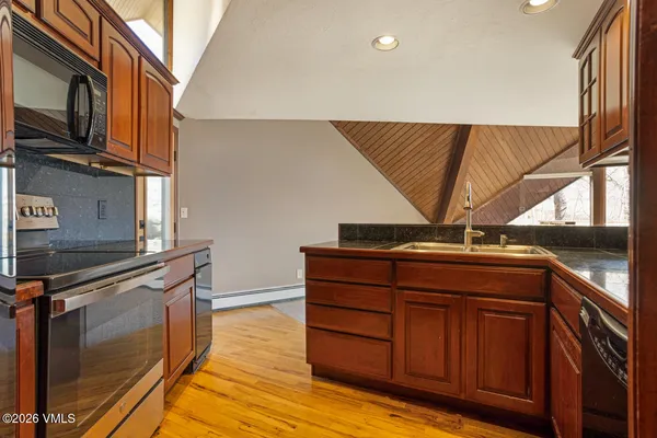 a kitchen with a sink and cabinets