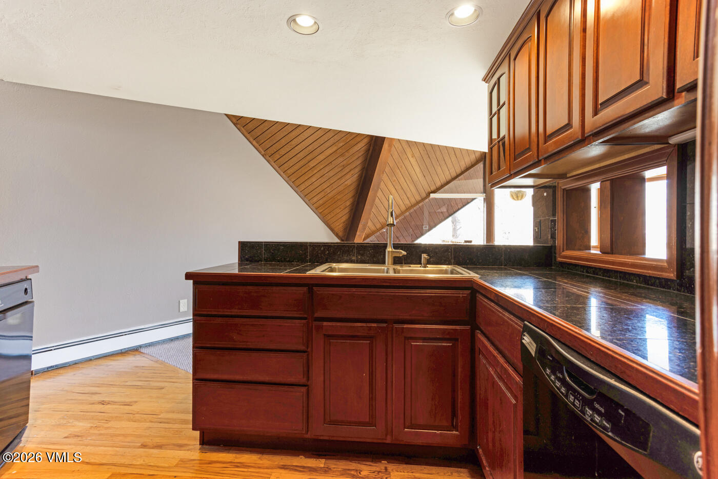 1400 Lions Ridge Loop, Unit A1 Vail, CO 81657 - Photo 14 of 41 a kitchen with a sink and cabinets