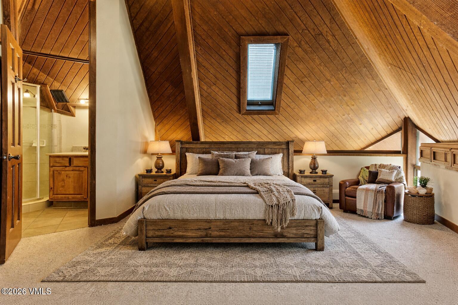 1400 Lions Ridge Loop, Unit A1 Vail, CO 81657 - Photo 16 of 41 a bedroom with bed and a couch